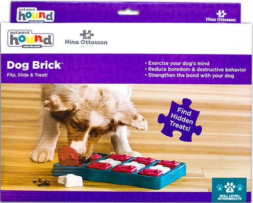 Nina Ottosson Dog Brick Interactive Treat Puzzle Dog Toy with hidden treat compartments and removable pieces for dogs.
