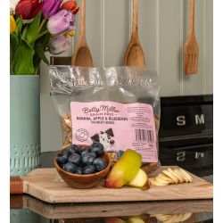 Betty Miller Banana Apple & Blueberry Bones dog treats with fresh fruits.