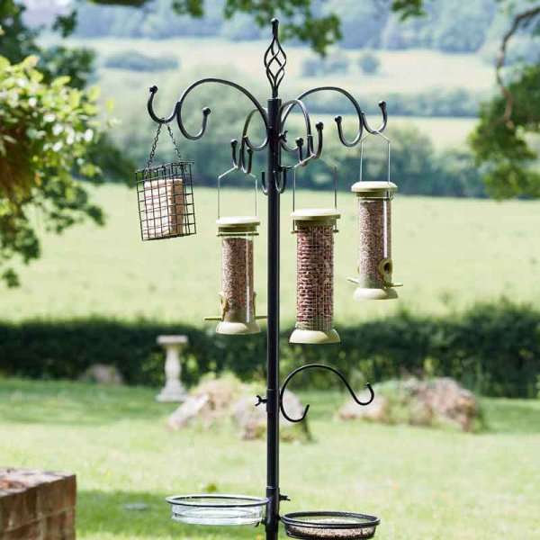 Chapelwood Complete Bird Feed Dining Station in black with feeders in a garden setting.