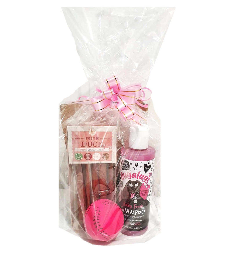 Gift wrapped Christmas bundles for pets with treats and shampoo.