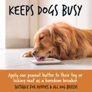 Golden retriever licking peanut butter from a dish, promoting Bugalugs Peanut Butter for Dogs as a natural, protein-rich treat and boredom breaker for all dog breeds and puppies