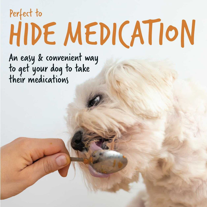 Bugalugs Peanut Butter for Dogs being fed to a dog as a medication aid with a spoon