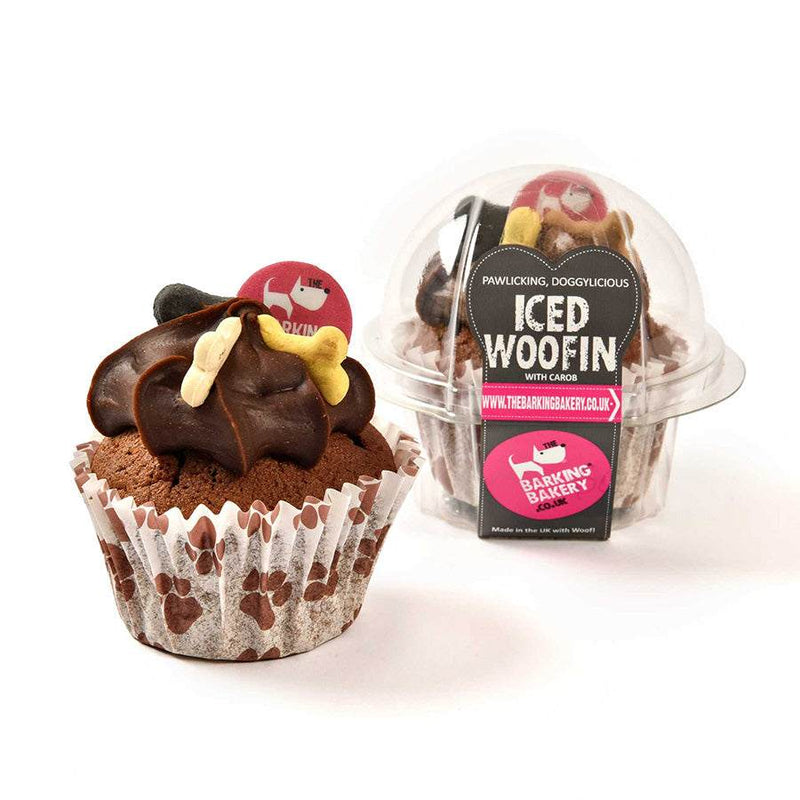 Barking Bakery Iced Carob Woofin Dog Treat with carob frosting, doggy bone biscuits, and paw print wrapper.