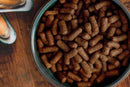 Bowl of McAdams Chicken Medium Breed grain-free dry dog food pellets made with British free-range chicken