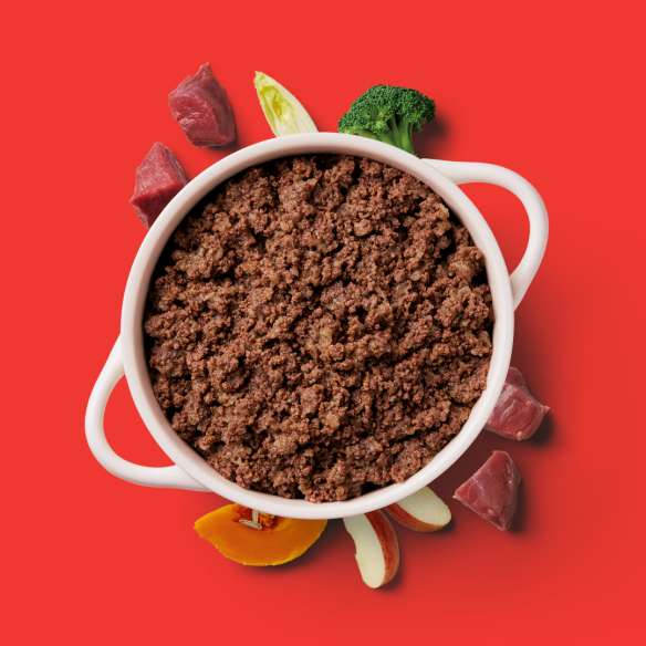 Gently steamed beef dog food with natural ingredients, displayed in a white bowl.