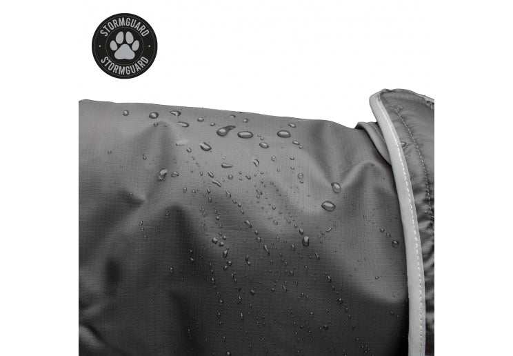 Ancol Stormguard Black Waterproof Dog Coat with water droplets showcasing waterproof feature.