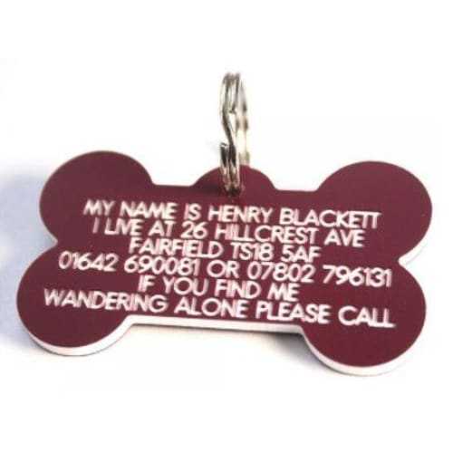58mm bone shaped plastic dog pet tag with engraved personal details.