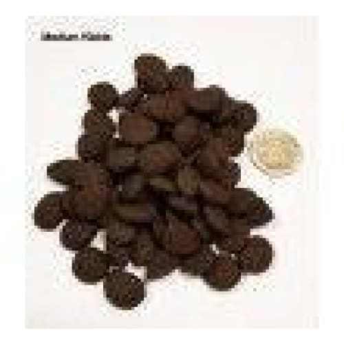 Eden Fish Cuisine Dry Dog Food kibble with a coin for size comparison.