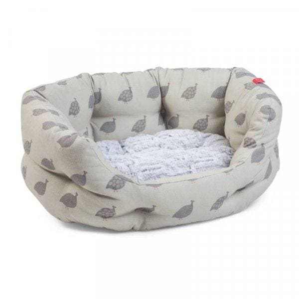 Feather Friends Oval Dog Bed in dark grey feather on light green, high sides, reversible cushion.