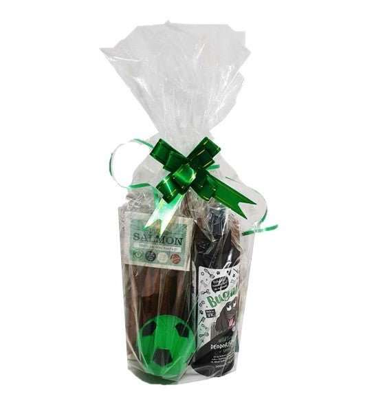 Gift wrapped Christmas bundles for pets with green ribbon.