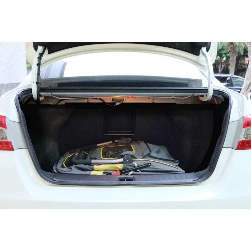 Innopet Hercules 2.0 Extra Large Dog Stroller folded in a car trunk, showcasing compact storage.