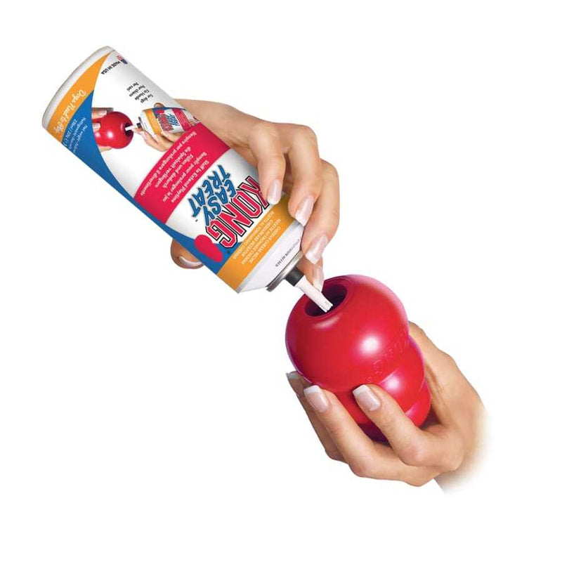 KONG Classic Dog Toy being filled with KONG Easy Treat.
