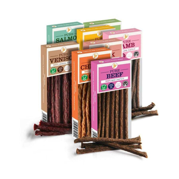 Assorted Pure Natural Dog Sticks packaging with various meat flavors, grain and gluten free.